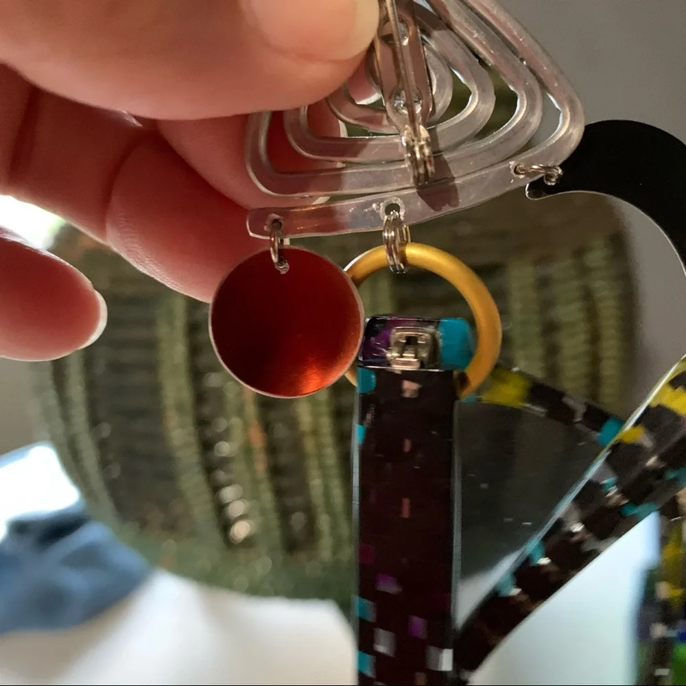 Lapel pin that also holds eyeglasses
